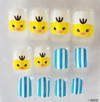 Close-up of colourful false nail tips for children.