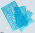 Set of 4 reusable plastic lettering stencils displayed together.