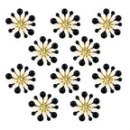 Black flower enamel and brass sew-on trim on a white background.