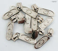 Silver 'G' zip pull with head slider on a white background