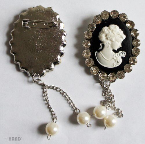 Close-up of a vintage brooch showcasing intricate crystal details.