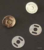 Magnetic buttons in use on a stylish snap bag for demonstration