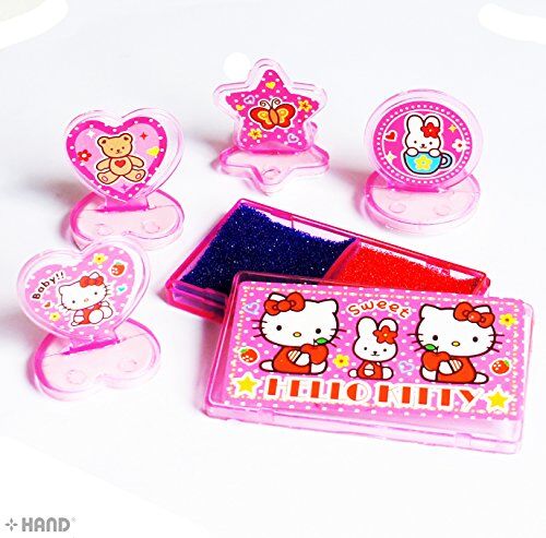 Close-up of Hello Kitty rubber stamps on a colourful background.