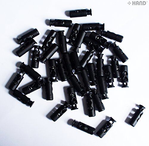 Display of small plastic toggle spring stop cord locks in packaging.
