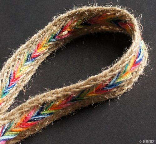 Different angles of the colourful and brown plait belt trim.