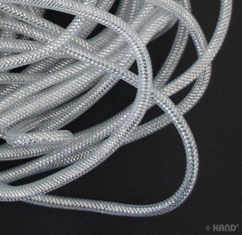 7mm silver crin elastic displayed on a measuring tape.