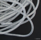 7mm silver crin elastic displayed on a measuring tape.