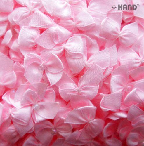 Display of small decorative ribbon bows with pearl detailing