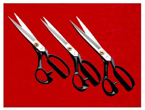 Tailoring scissors displayed on a fabric background