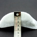 Shoulder pads placed on a fabric background for styling.