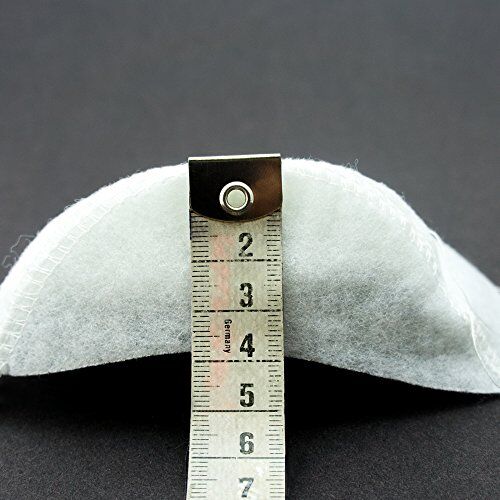 Shoulder pads placed on a fabric background for styling.