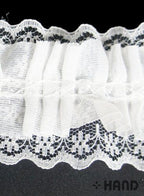 Black elastic lace trim used in a crafting project