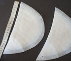 Close-up of 13mm thick white shoulder pads