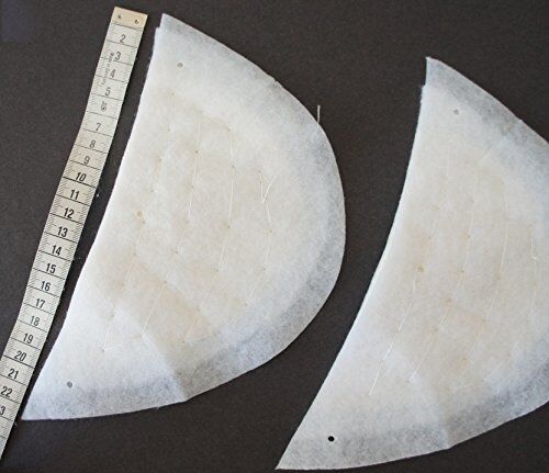 Close-up of 13mm thick white shoulder pads