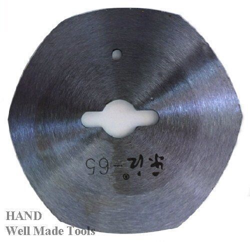 Close-up of a 65 mm rotary cutter blade showing sharp edge