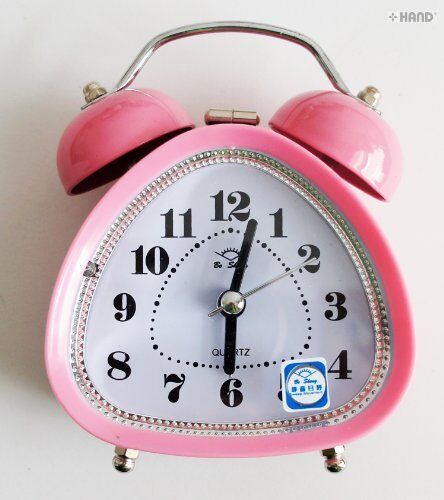 Close-up of the twin bell mechanism on the alarm clock