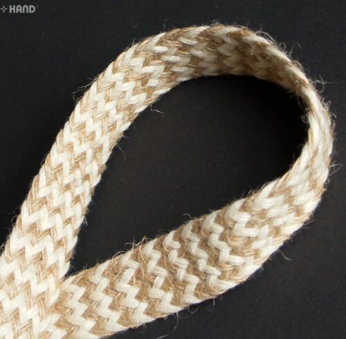 Roll of cream and brown plait belt rope cord trim showing its texture.