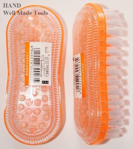 Close-up of a colourful garment brush showing bristles and handle.