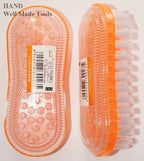 Close-up of a colourful garment brush showing bristles and handle.
