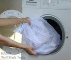 Two large zipped laundry bags in white, 50x60cm size.