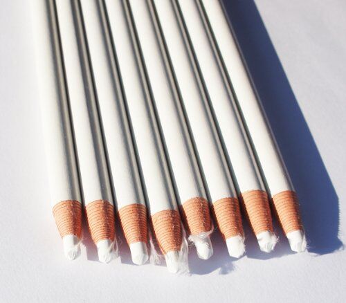 Display of the 17cm white wax china marker pencils in a row.