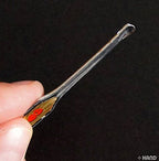 Close-up of the engraved handle on the earpick