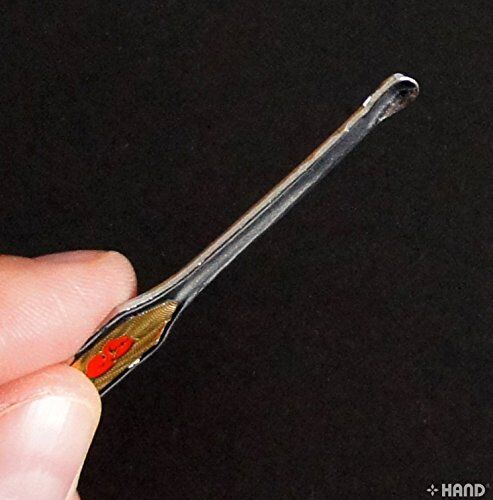 Close-up of the engraved handle on the earpick
