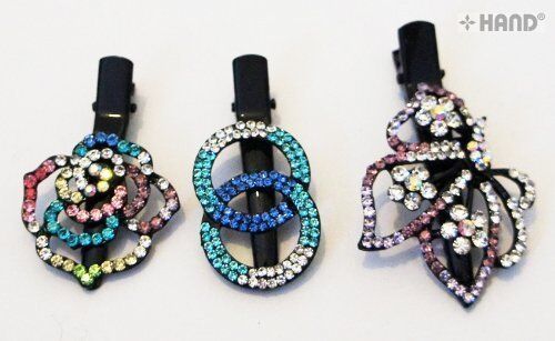 Three assorted design hair clips with shiny diamante details.