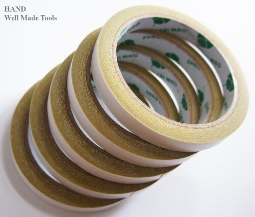 Five rolls of classic yellow double sided adhesive tape, 12mm wide.