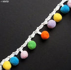Roll of 23mm wide colourful pom pom trim for sewing projects