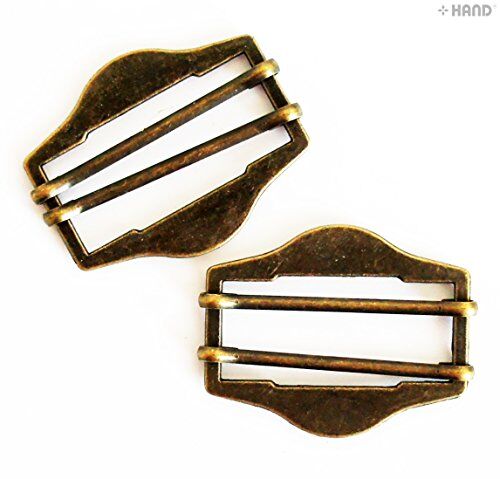 Antique gold buckle on a fabric background