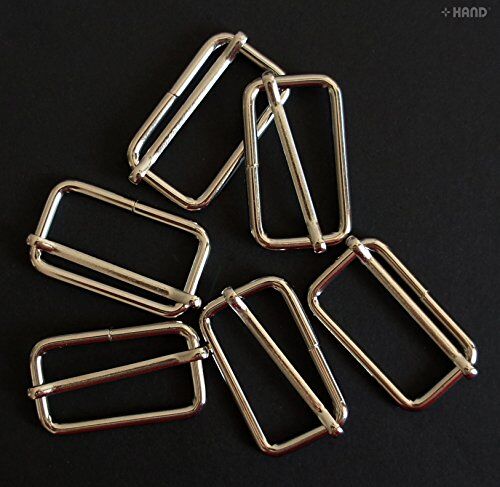 Display of silver tone metal sliders arranged neatly.