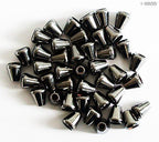 Close-up of dark copper tone cord fastener ends on a white background