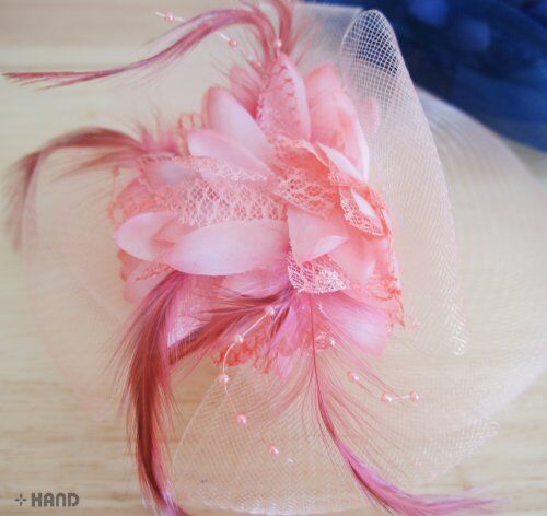 Close-up of lace headdress accessory in vibrant colours