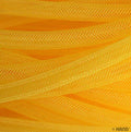 Close-up of yellow tubular crin trim showing texture