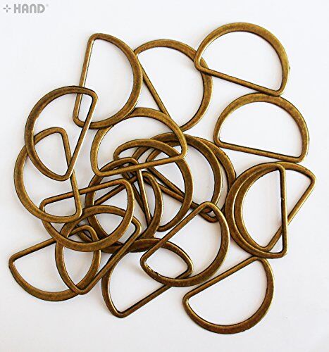 Antique gold metal D shape handbag buckle in various sizes.