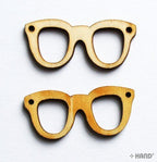 Assorted small wooden glasses trims in various designs