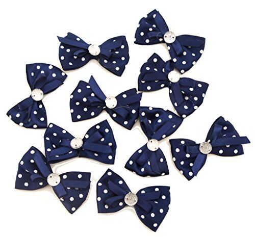 Dark blue ribbon bow trim with white polka dots and crystal bead centre.