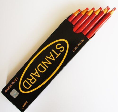 Close-up of a red wax china marker pencil, 17cm in length.