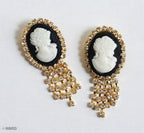 Close-up of a vintage small brooch showcasing intricate details.