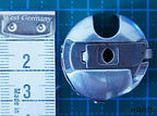 Side view of the genuine Towa bobbin case with top slot.