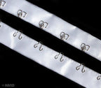 Full view of 5 metres of white satin ribbon tape with silver hooks.