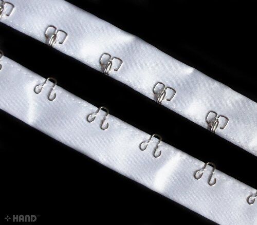 Full view of 5 metres of white satin ribbon tape with silver hooks.