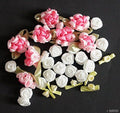 Assorted decorative craft flowers in vibrant colours.