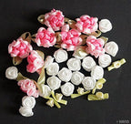 Assorted decorative craft flowers in vibrant colours.