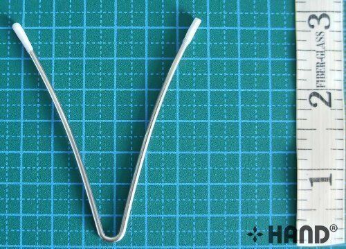 V wires displayed on a fabric background for crafting.