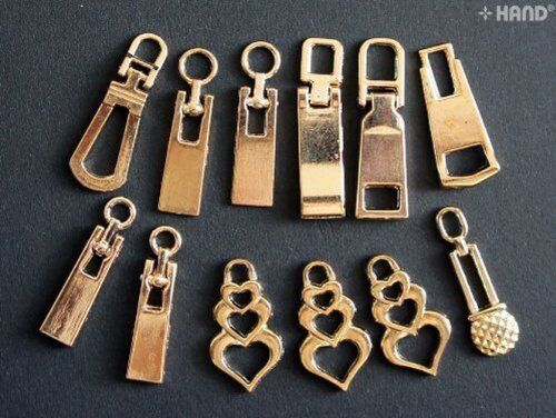 Close-up of gold zip pulls with eyelets for crafting