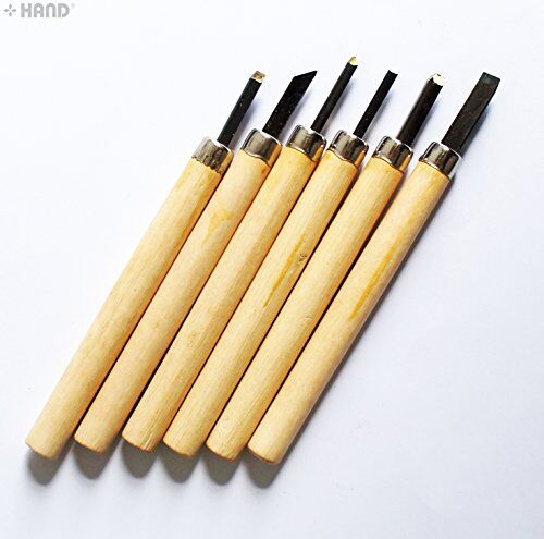 Set of 6 wood carving chisels displayed on a wooden surface
