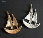 Close-up of a clear crystal boat brooch showcasing its design