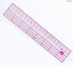 Ruler laid flat on a patchwork quilt for accurate measurements.